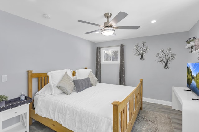 bedroom featuring ceiling fan and dark hardwood / wood-style flooring