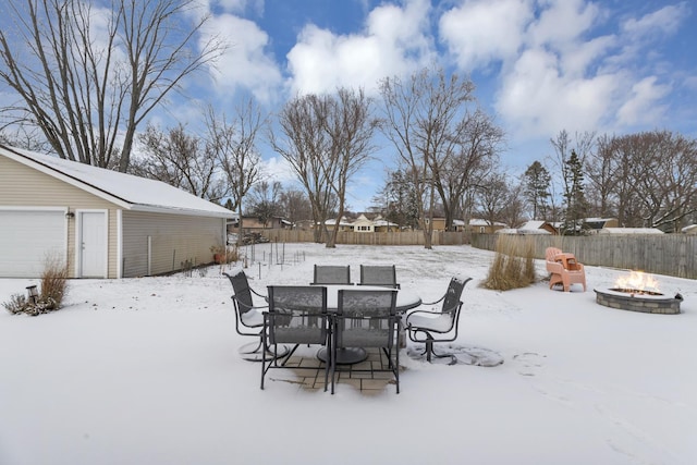 snowy yard with a fire pit