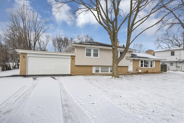 split level home featuring a garage