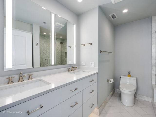 bathroom featuring vanity, toilet, and walk in shower