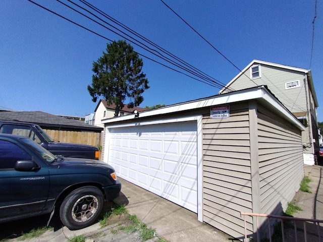 view of home's exterior featuring an outbuilding and a garage