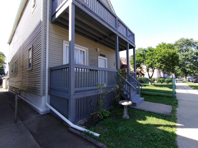 view of side of home with a lawn