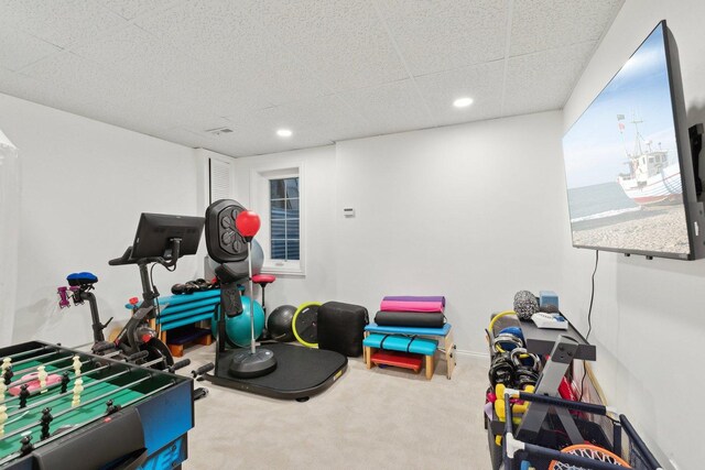 carpeted bedroom with a paneled ceiling