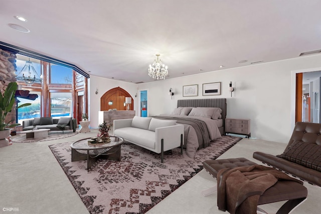 carpeted bedroom featuring a notable chandelier