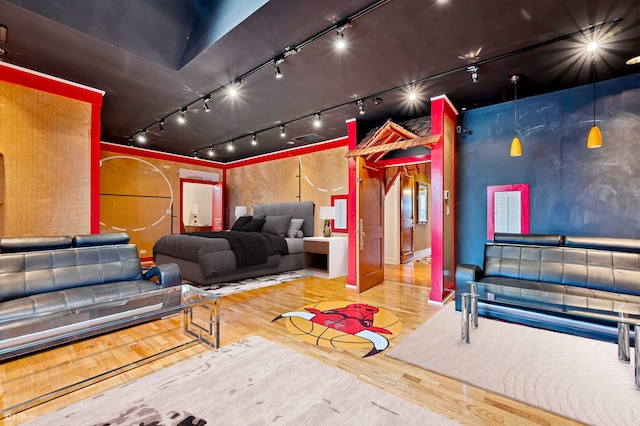 game room featuring wood-type flooring and track lighting