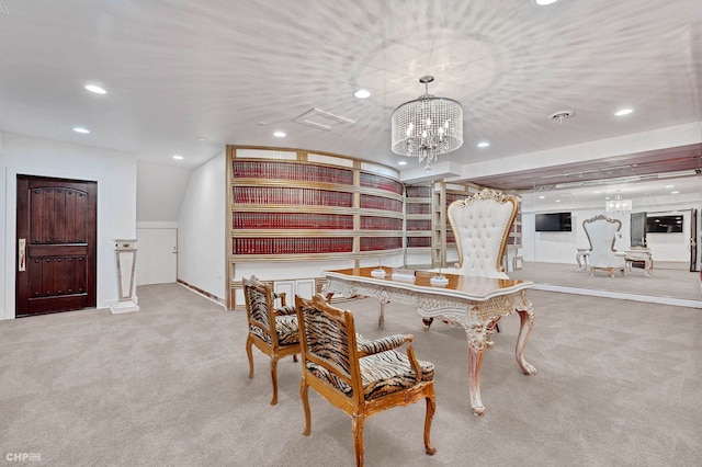 dining space with a notable chandelier and light colored carpet