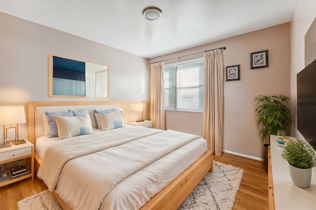 bedroom with light wood-type flooring