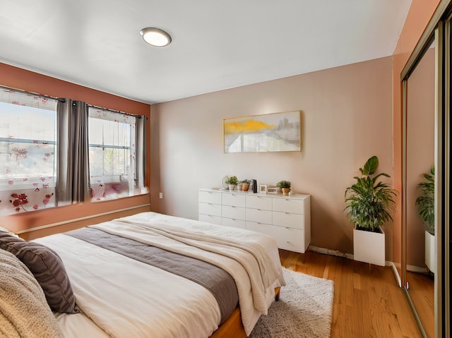 bedroom with light hardwood / wood-style floors