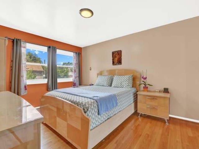 bedroom featuring light wood-type flooring