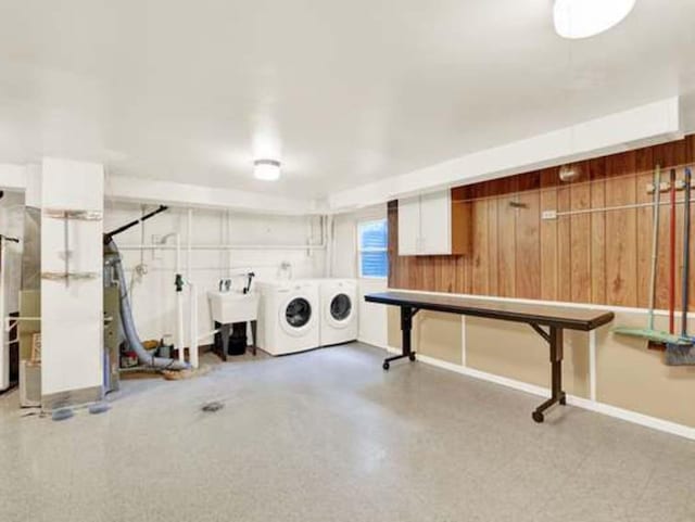 laundry room featuring sink and washer and clothes dryer