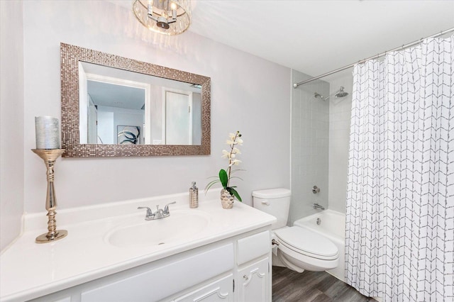 full bathroom with vanity, hardwood / wood-style floors, shower / bath combination with curtain, and toilet