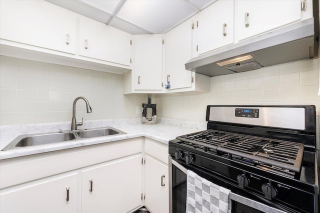 kitchen with white cabinetry, sink, backsplash, and black gas range