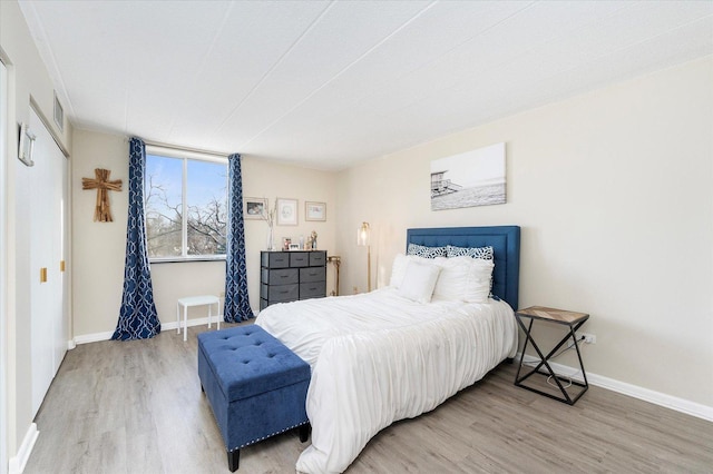 bedroom with hardwood / wood-style flooring