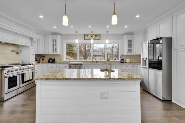 kitchen featuring white cabinetry, appliances with stainless steel finishes, and a kitchen island