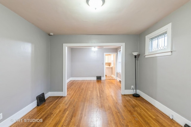 unfurnished room with light hardwood / wood-style floors