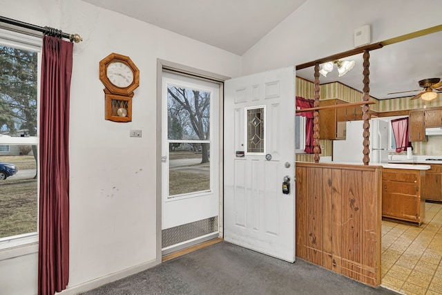 interior space with vaulted ceiling and ceiling fan