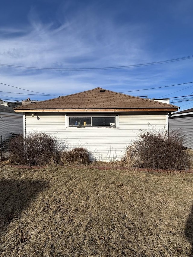 view of side of home featuring a yard