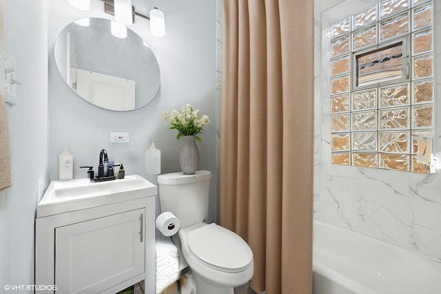 full bathroom with vanity, toilet, and shower / tub combo with curtain