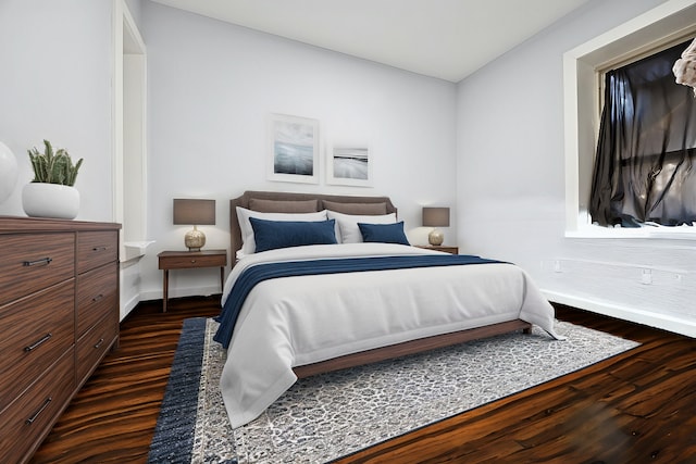 bedroom featuring dark wood-type flooring