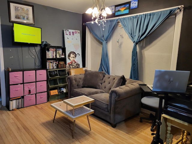 living room featuring hardwood / wood-style flooring and a chandelier