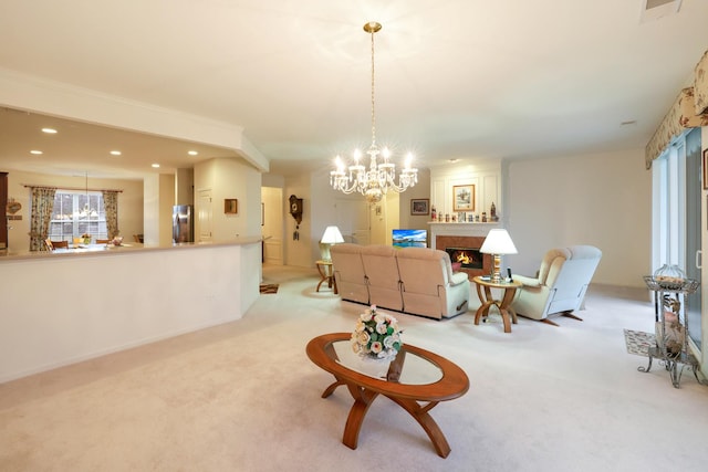 living room with light carpet and a chandelier