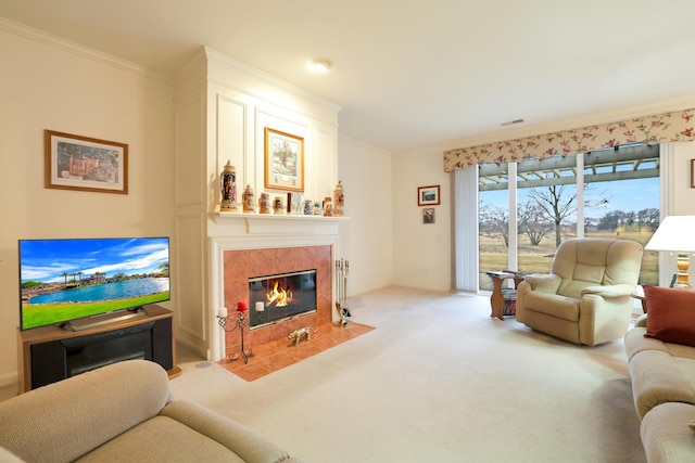 living room with light carpet, crown molding, and a tile fireplace