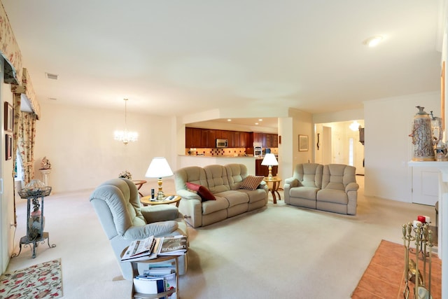 carpeted living room with a chandelier