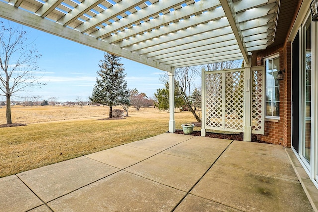 view of patio / terrace featuring a pergola and a rural view