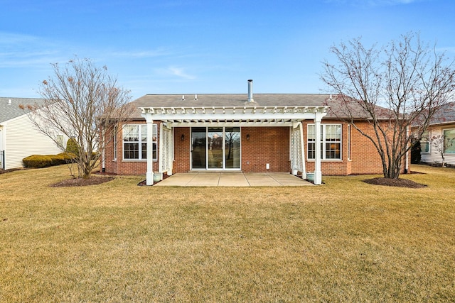 rear view of house with a patio area and a lawn