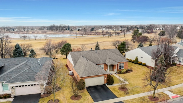 birds eye view of property with a rural view