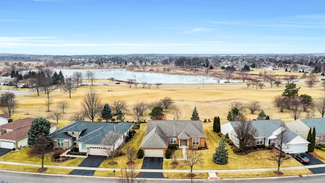 drone / aerial view with a water view