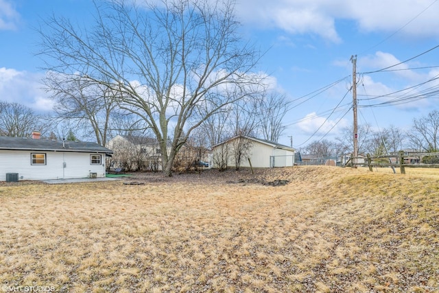 view of yard featuring a patio and central AC unit