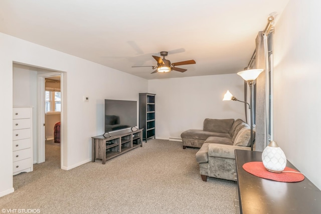 carpeted living room with ceiling fan and baseboard heating