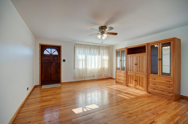 entryway featuring ceiling fan and light hardwood / wood-style flooring