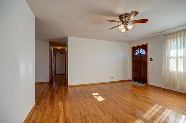 entrance foyer with ceiling fan and light wood-type flooring