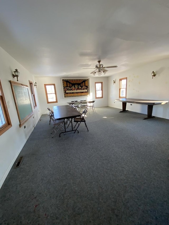 recreation room featuring ceiling fan and carpet