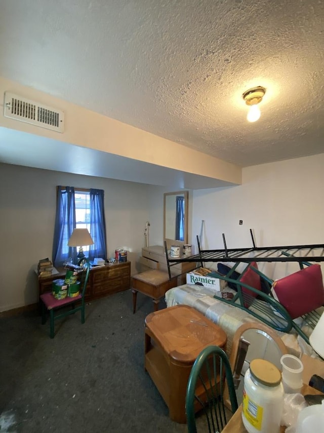 interior space featuring a textured ceiling