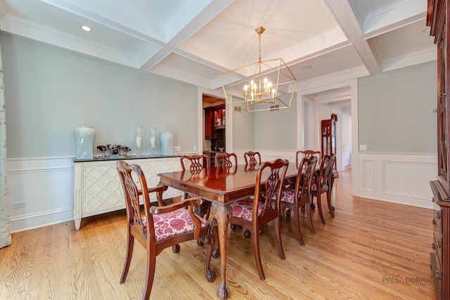 dining space featuring coffered ceiling, light hardwood / wood-style flooring, and beamed ceiling