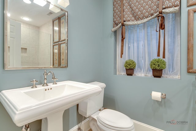 bathroom featuring sink and toilet