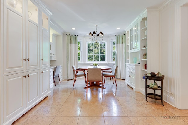 dining space featuring crown molding, light tile patterned floors, and a notable chandelier