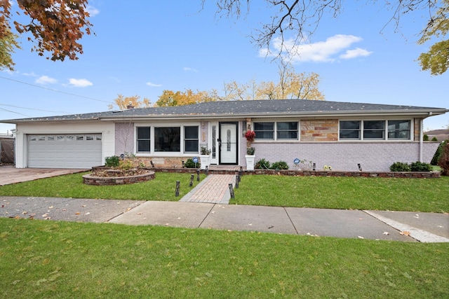 ranch-style home featuring a garage and a front lawn