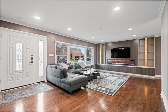 living room with ornamental molding and hardwood / wood-style floors