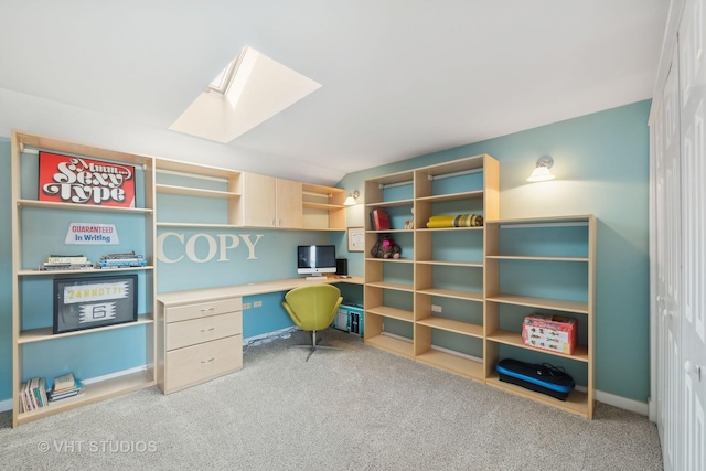 office space featuring light carpet and a skylight