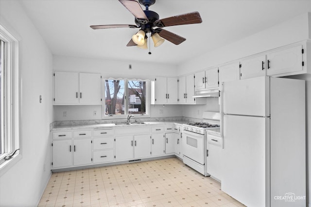 kitchen featuring white cabinetry, white appliances, ceiling fan, and sink