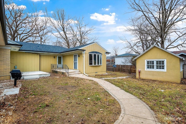 view of side of property featuring a yard