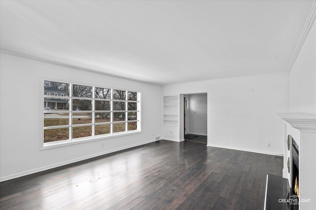 unfurnished living room featuring crown molding and dark wood-type flooring