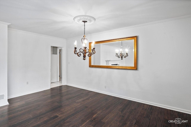 unfurnished room featuring wood-type flooring, ornamental molding, and a notable chandelier