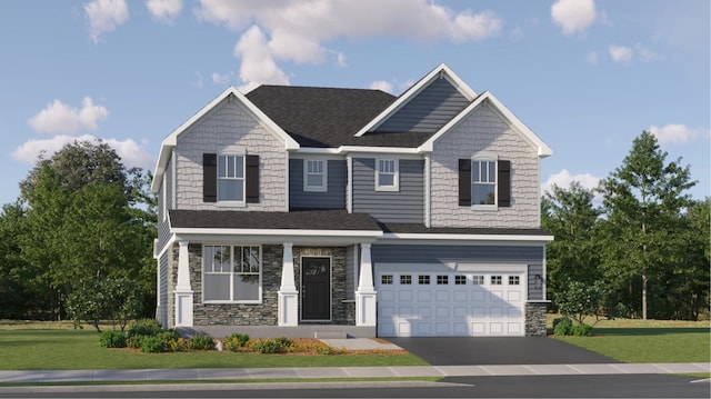 craftsman house with a garage and a front lawn