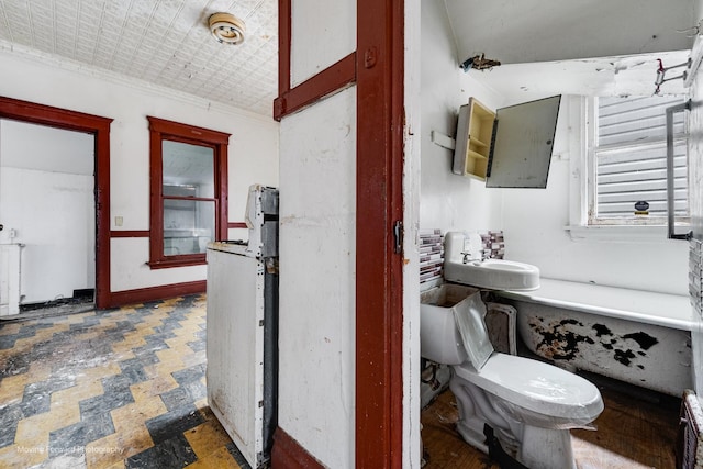 bathroom featuring sink and toilet