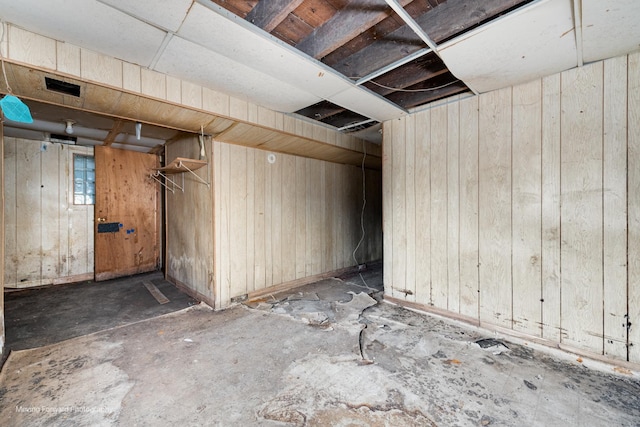 basement with wood walls